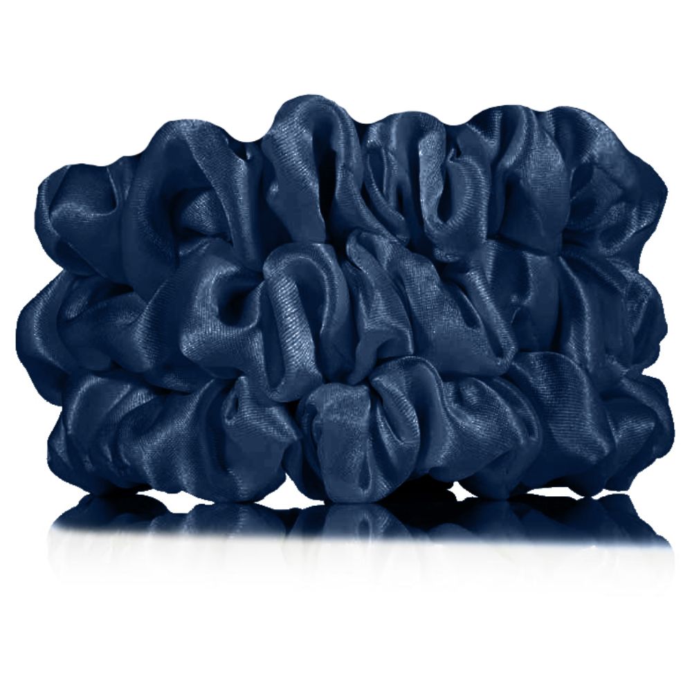 Set of blue scrunchies on a white background