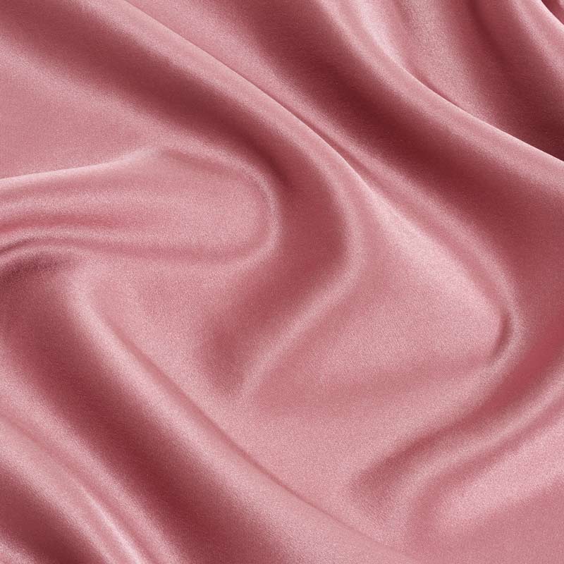 Dark pink silk pillowcase close up