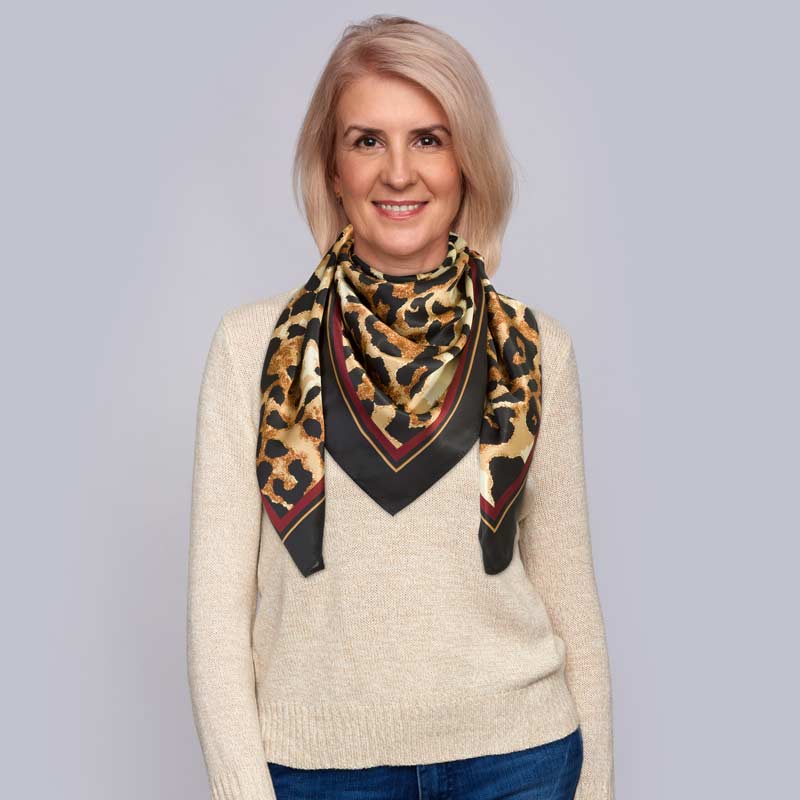 a woman wearing a silk scarf