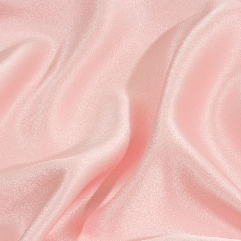 Light pink silk pillowcase close up