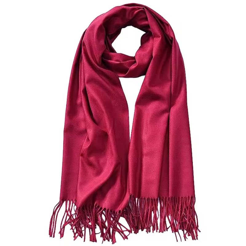 Red scarf with fringes on a white background