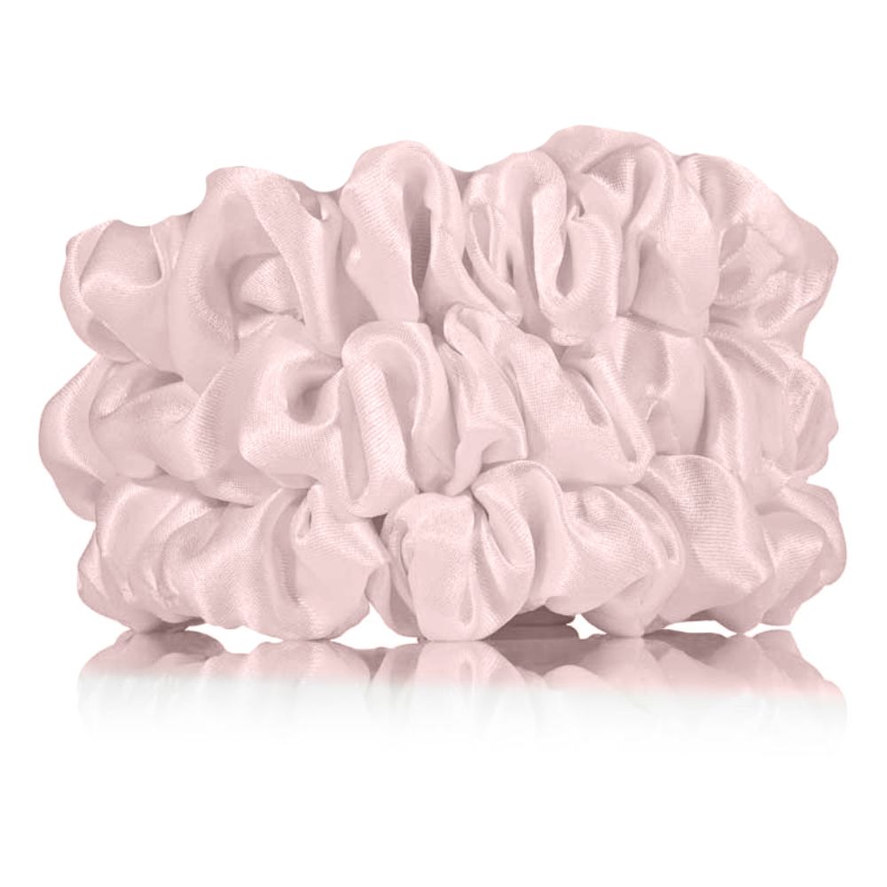 Pink scrunchies on a white background