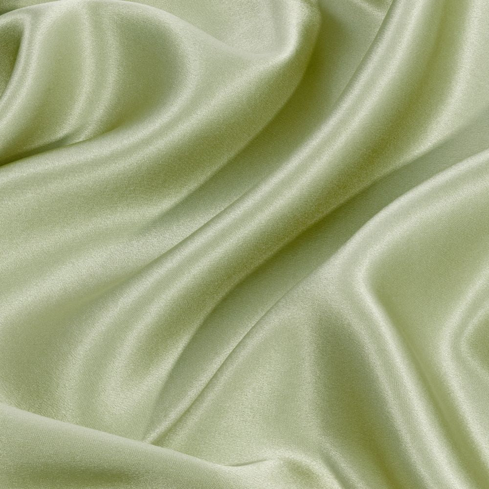 Silky green silk with folds and creases